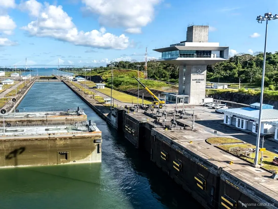 Electric locomotive guiding a ship through the Gatun Locks