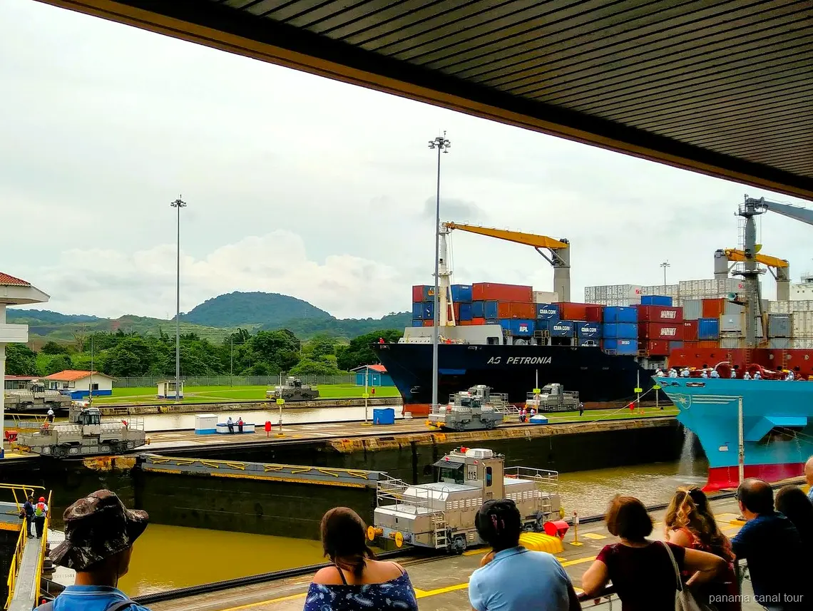 Cargo ship viewed from a wildlife boat tour on the Panama Canal