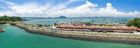 Small group at the Amador Causeway sign on a Panama Canal and skyline tour