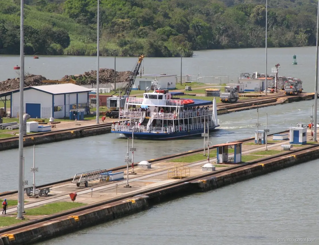 Passenger vessel transiting the Miraflores Locks on a Panama Canal boat tour