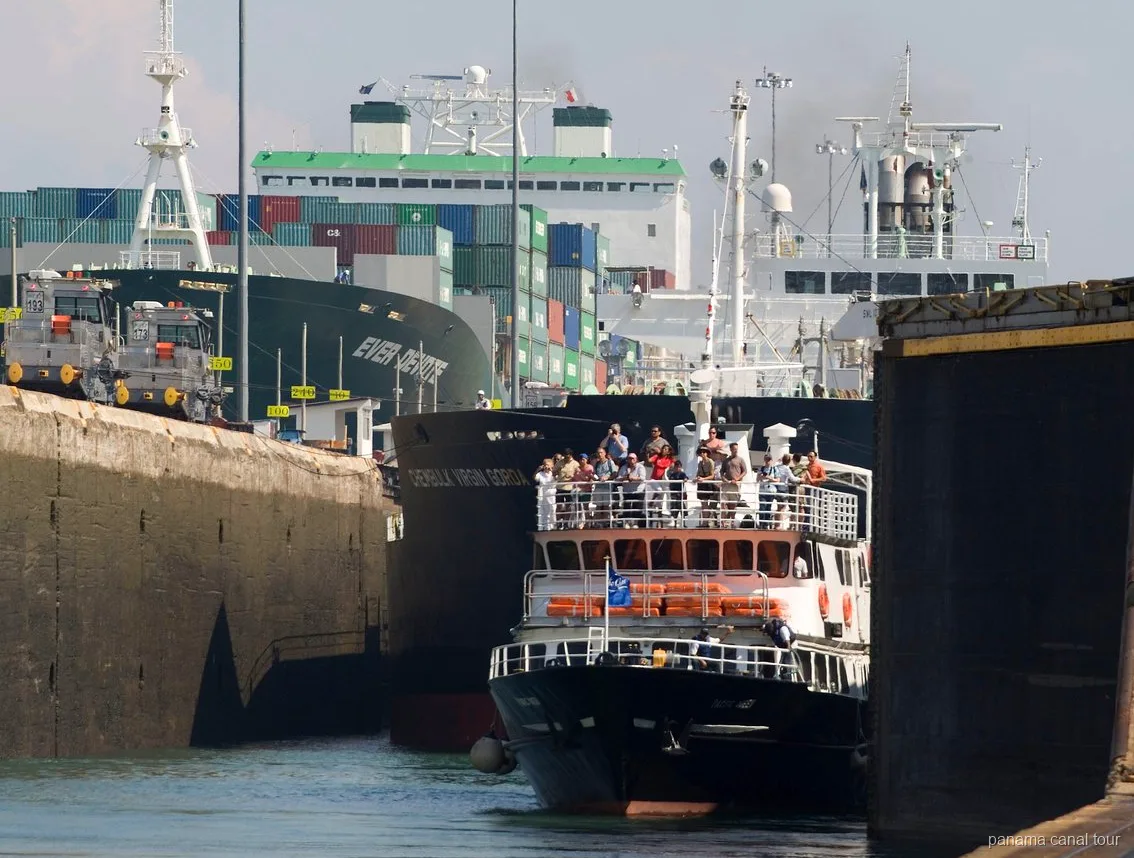 Small vessel transiting the Panama Canal locks on a full transit cruise